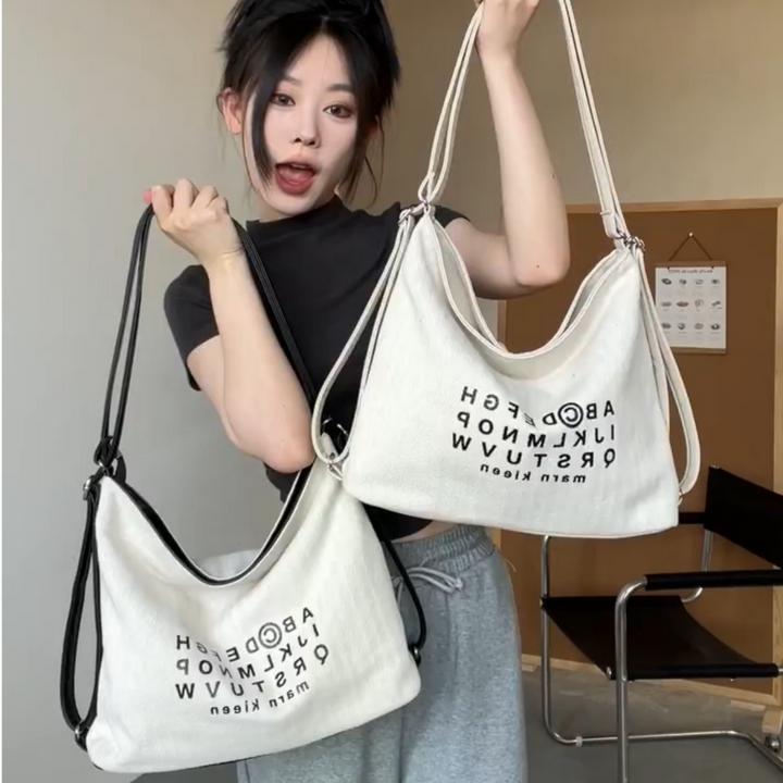 大容量帆布包包女2025新韩国小众字母托特包时尚大学生单肩双肩包