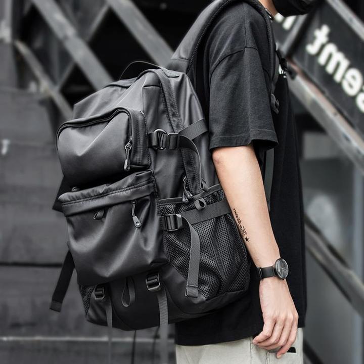 时尚潮流休闲背包男双肩包大容量旅行包初中高中大学生书包女男包