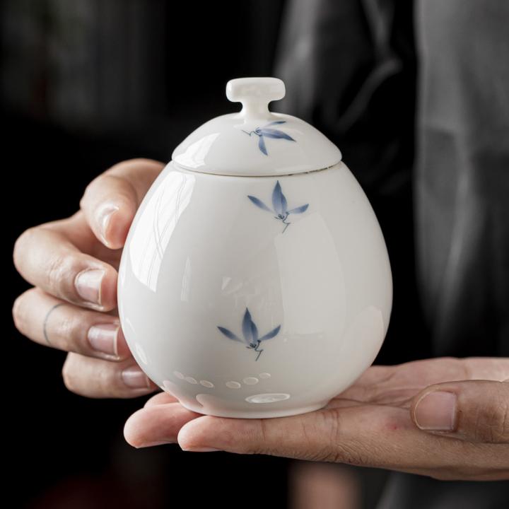 手绘蝴蝶兰茶叶罐白瓷密封罐普洱茶盒陶瓷防潮收藏罐家用茶缸便携