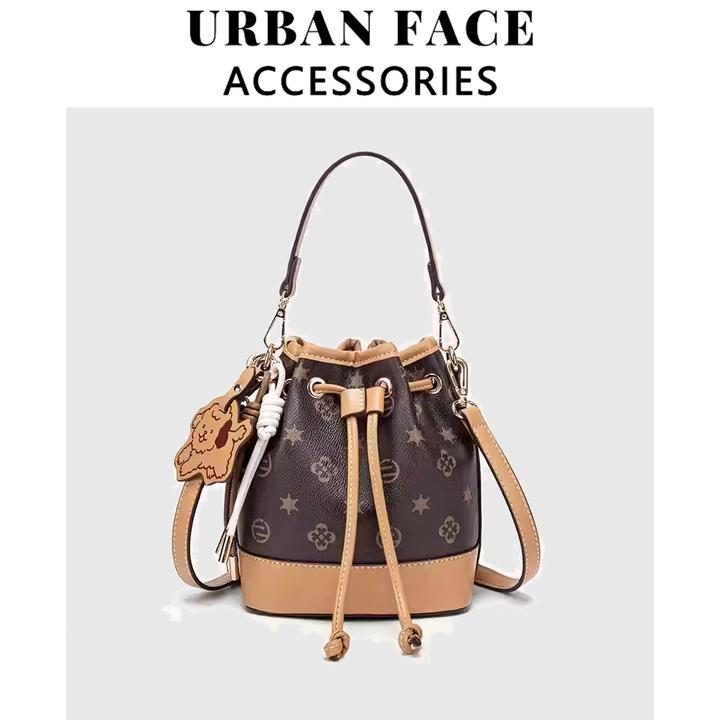 UR轻奢印花抽绳水桶包女2025新款休闲复古手提包大容量轻便斜挎包