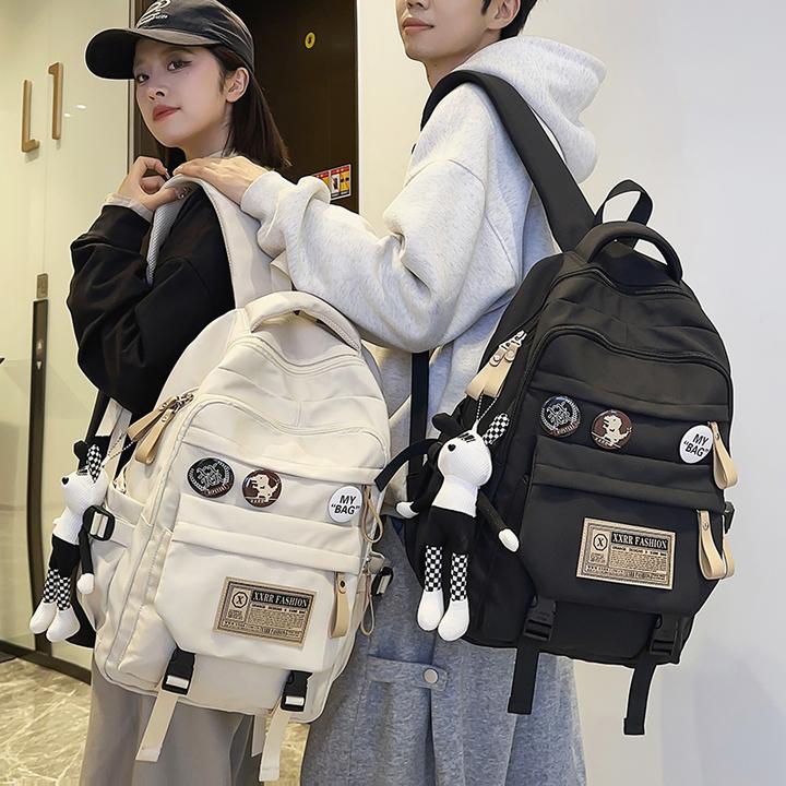 减负护脊大容量男士双肩包书包女初中生轻便出游大学生旅行背包女