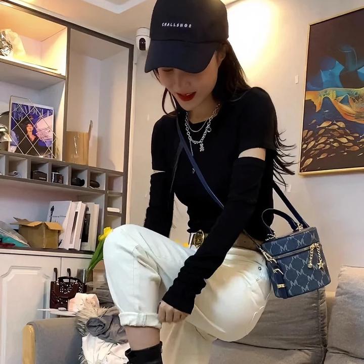 正肩时髦破洞镂空黑色长袖t恤女春秋内搭韩范短款修身收腰打底衫