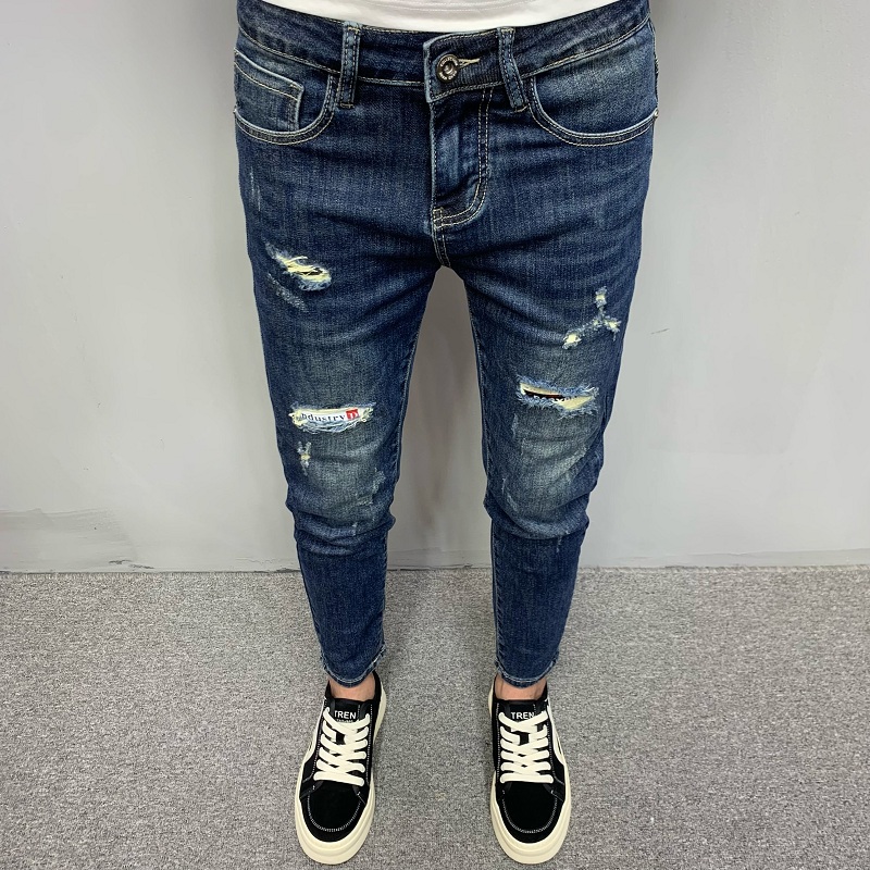 高档蓝色牛仔裤男款韩版潮流修身小脚百搭休闲痞帅个性破洞九分裤