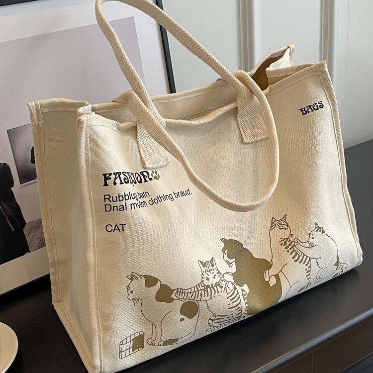 单肩帆布包包女男款大学生肩包托特包小众夏季白色小清新印花