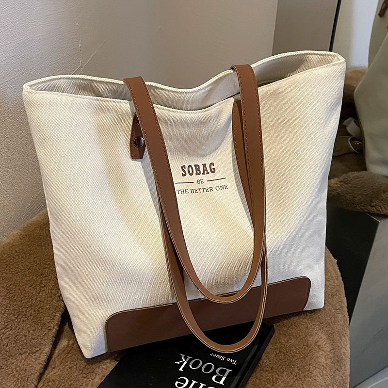 今年流行帆布包包女士2025新款大容量单肩包上班托特包上课通勤包