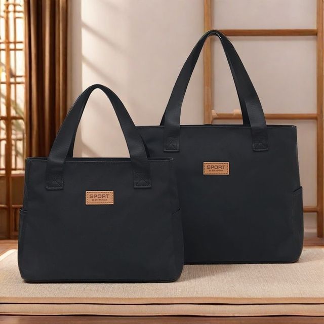 新款时尚男士手提包外出轻便男女通用通勤包大容量防水妈咪布包