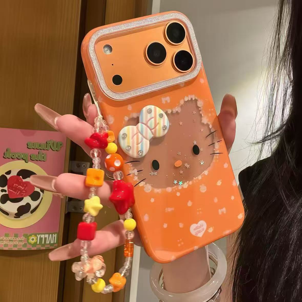 细闪星宇橙镂空Kitty脑袋适用iPhone17promax手机壳苹果16/15/14