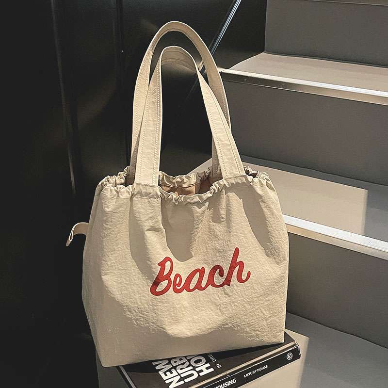 旅游轻便单肩包包女2025新款日系学生党通勤托特包大容量帆布包袋