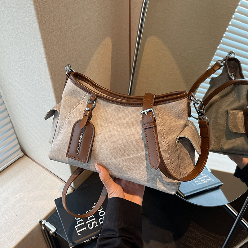 艾米兔 X COOLE女包2025新款休闲通勤纯色简约小众大容量斜挎包