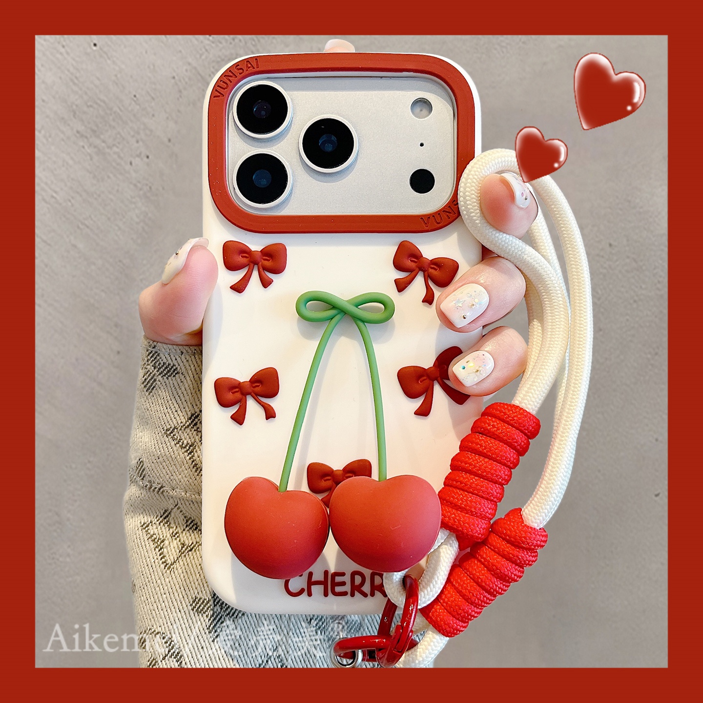 适用苹果17promax手机壳立体红蝴蝶结樱桃iPhone16promax编织挂绳
