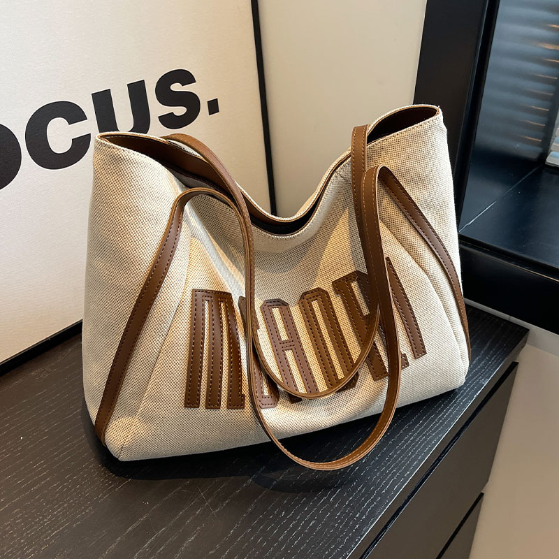 浦乐飞2025新款帆布托特包女大容量小众手提单肩大学生上课通勤包