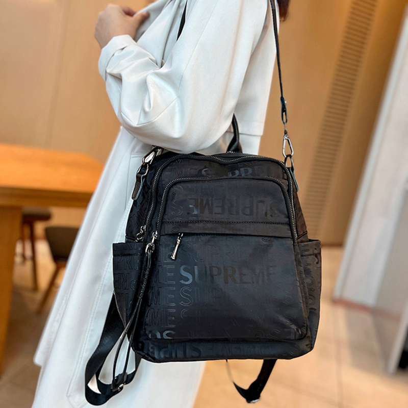 时尚印花轻便大容量尼龙布双肩包女包2025防水两用背包旅行单肩包