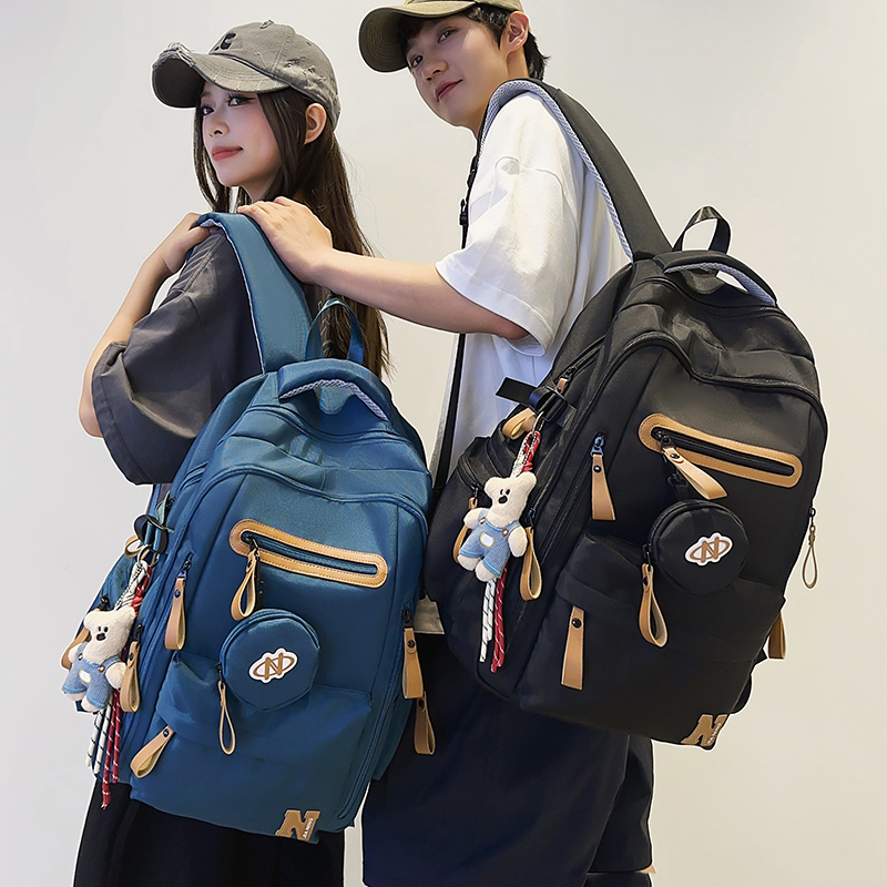 减负护脊书包男初中生大容量背包韩版高中大学生时尚潮流双肩包女