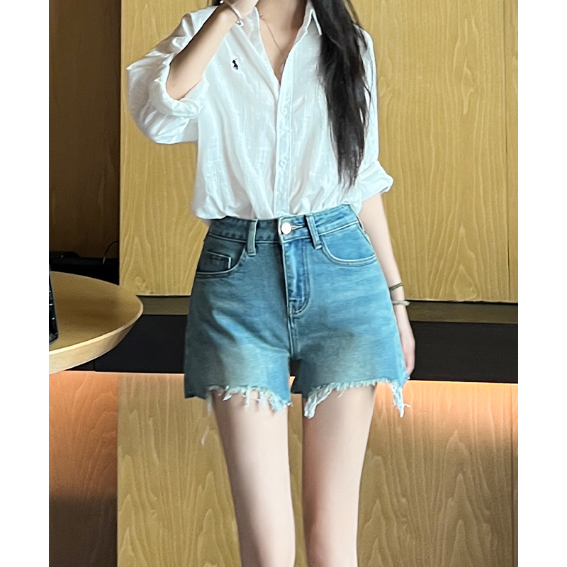 浅蓝色破洞牛仔短裤2025年秋季新款个性高腰水洗A字阔脚热裤女
