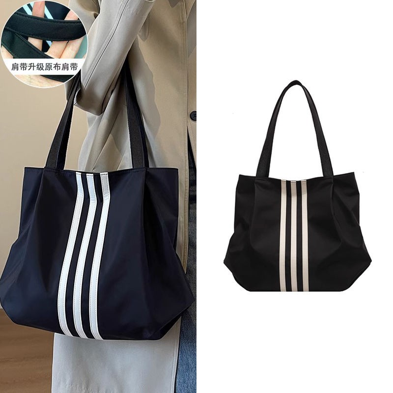 韩版帆布包女2025新款小众款高级感时尚通勤上课大容量单肩托jmn