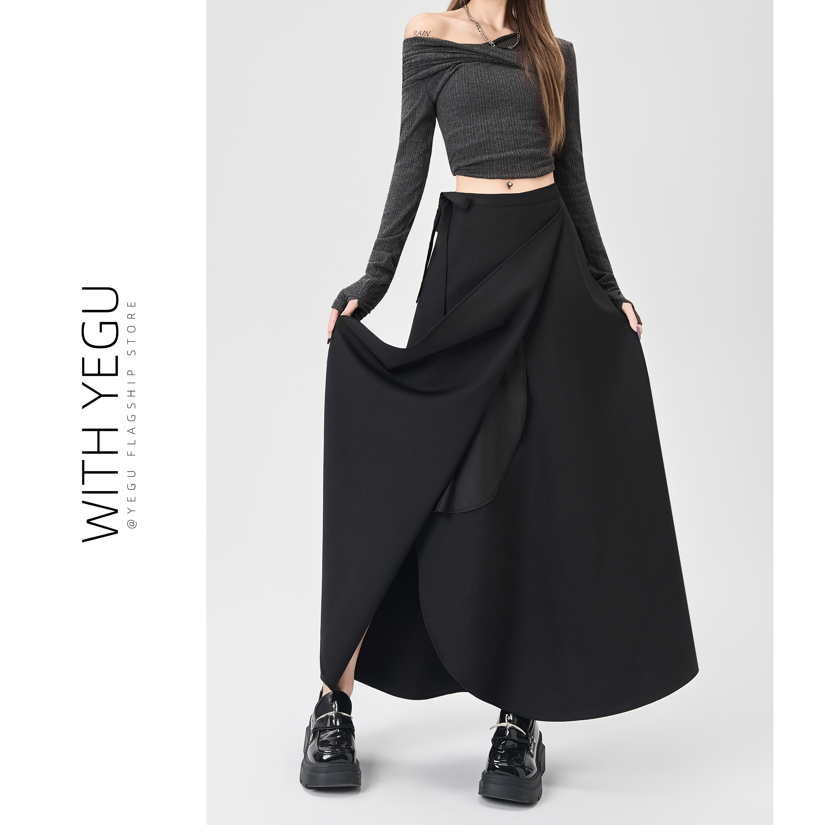 高级感黑色一片式绑带半身裙女春秋高腰设计感a字伞裙气质西装裙