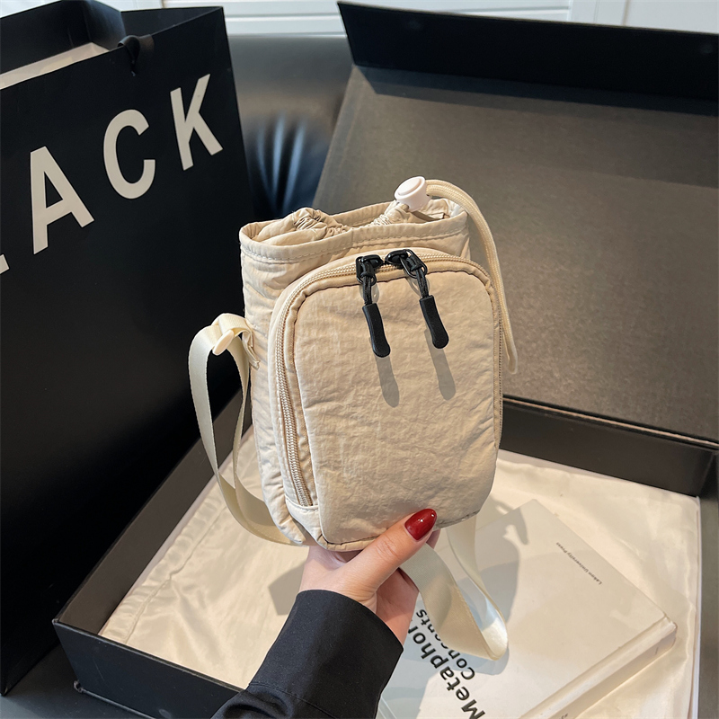 25新款便携水壶包抽绳式简约纯色帆布小包包女出门单肩斜挎手机包