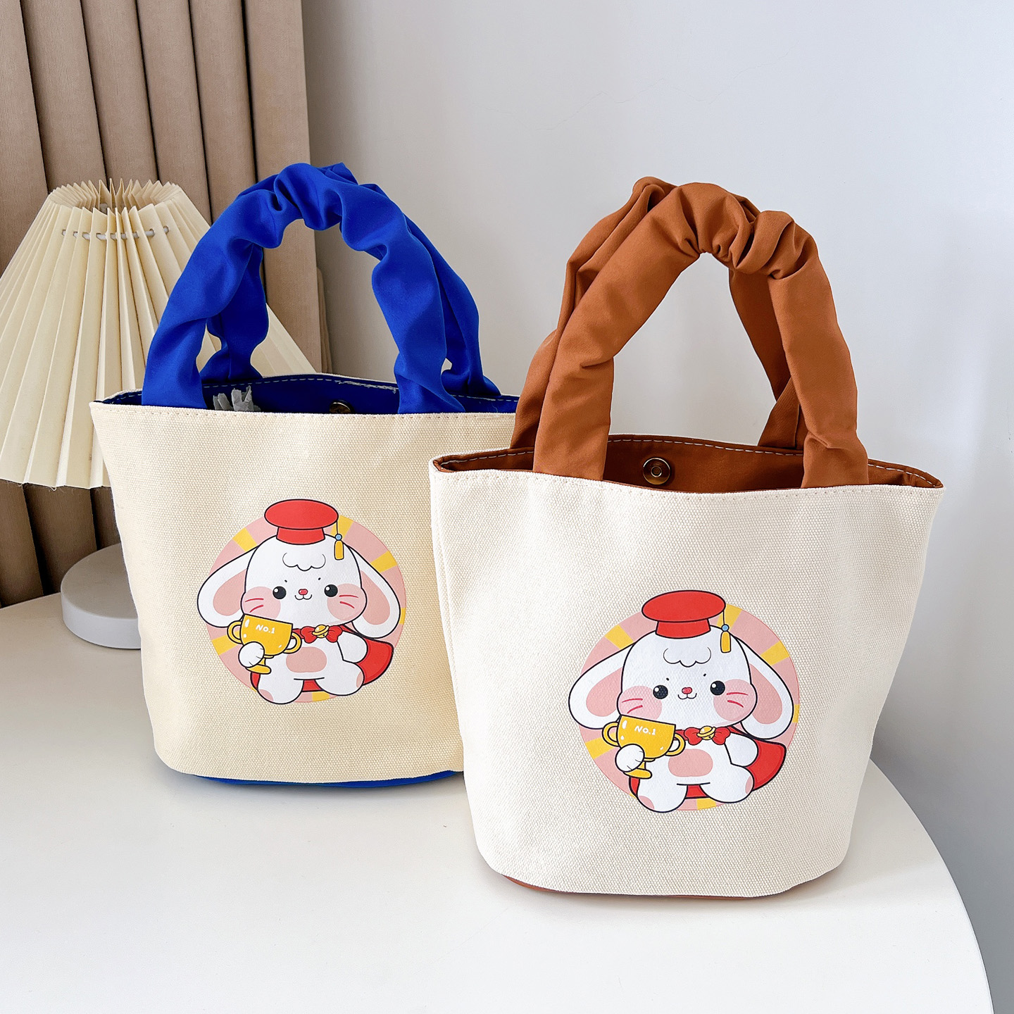 新款卡通可爱手提包手提袋水桶包帆布包妈咪包学生上班族便当包