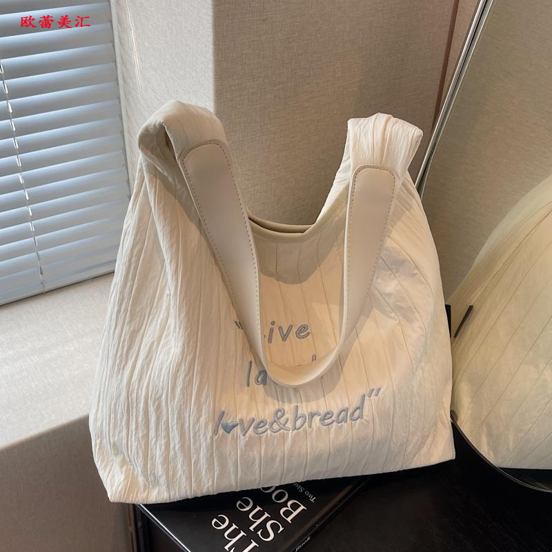 高颜值帆布托特包2025新款时尚洋气褶皱单肩腋下女包大容量通勤包