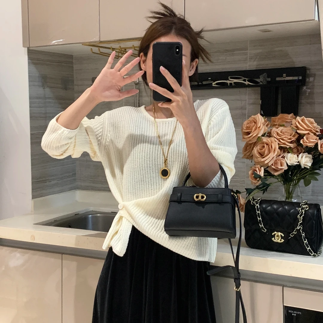 韩系设计感下摆提扣针织衫女秋季新款百搭简约休闲纯色毛衣