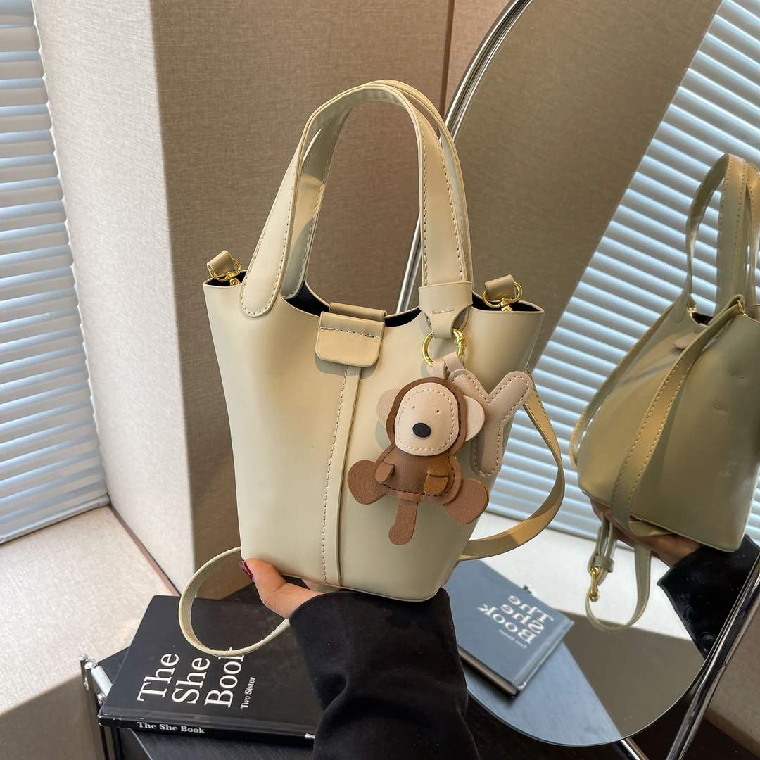 佐猫女士包包2024春夏新款水桶包高级感小众手提单肩包百搭斜挎包