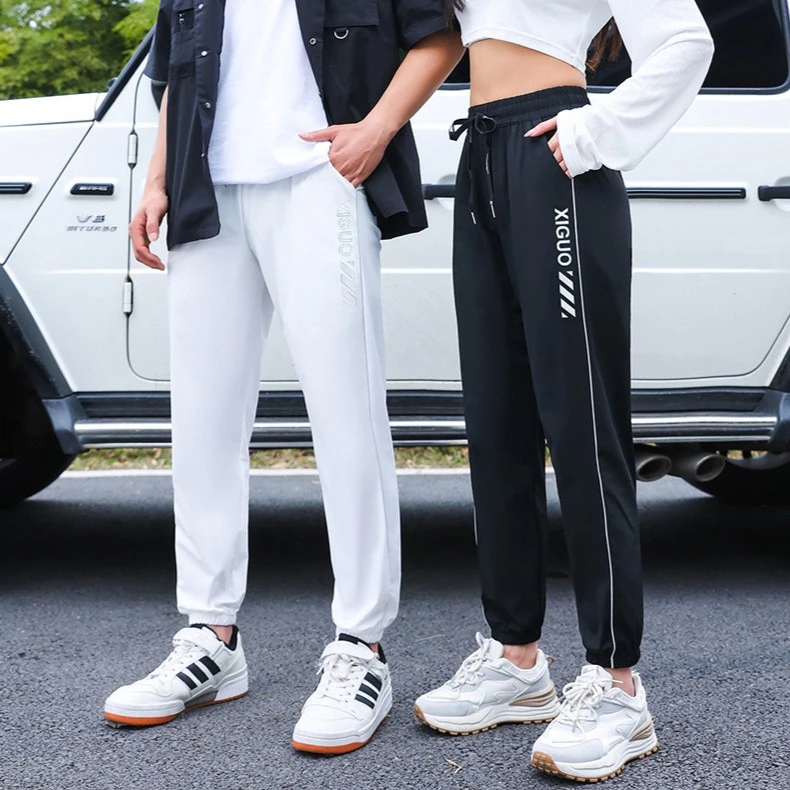 可乐防污速干裤夜光运动休闲裤男女夏季宽松束脚薄款百搭冰丝卫裤