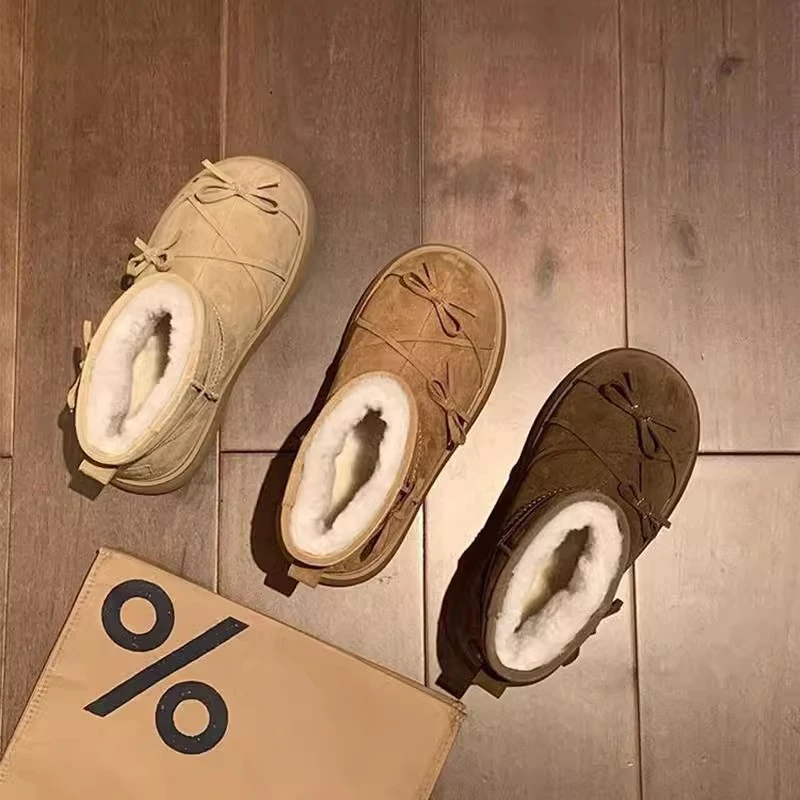 蝴蝶结雪地靴女冬季2025年新款百搭厚底短靴皮毛一体加绒东北棉鞋