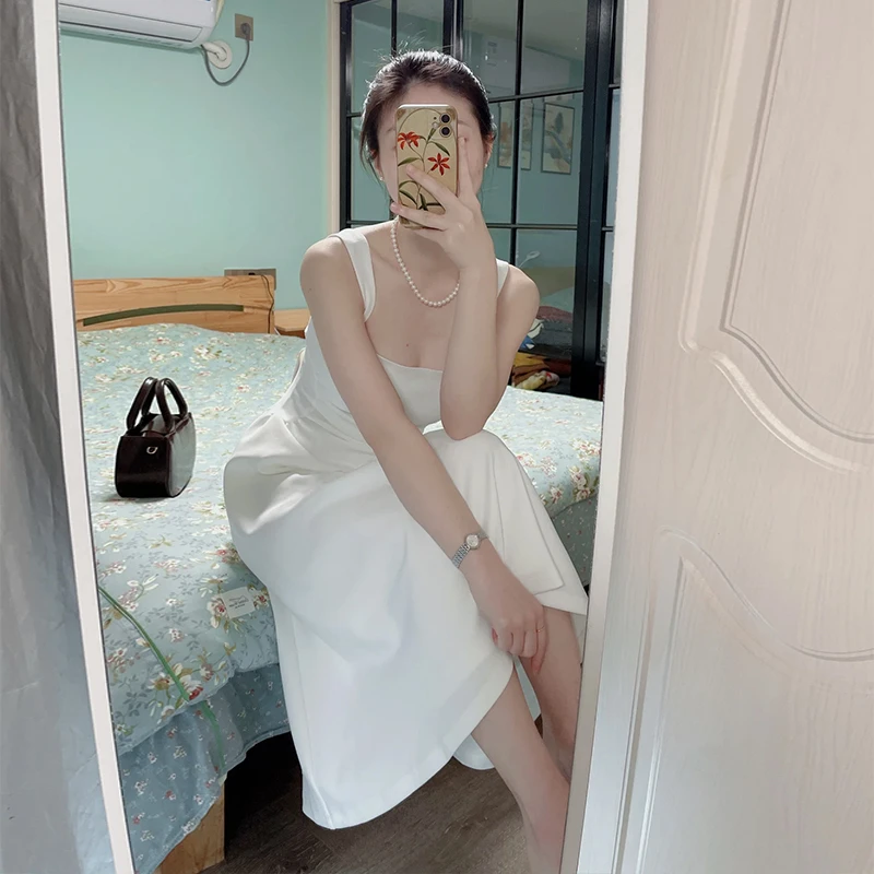 9244茶歇法式吊带无袖连衣裙2024年新款夏季收腰显瘦白色长裙子女