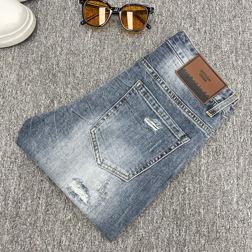 SEXCOOL2025年高端欧货牛仔裤男四季款潮牌破洞补丁蓝色修身小脚