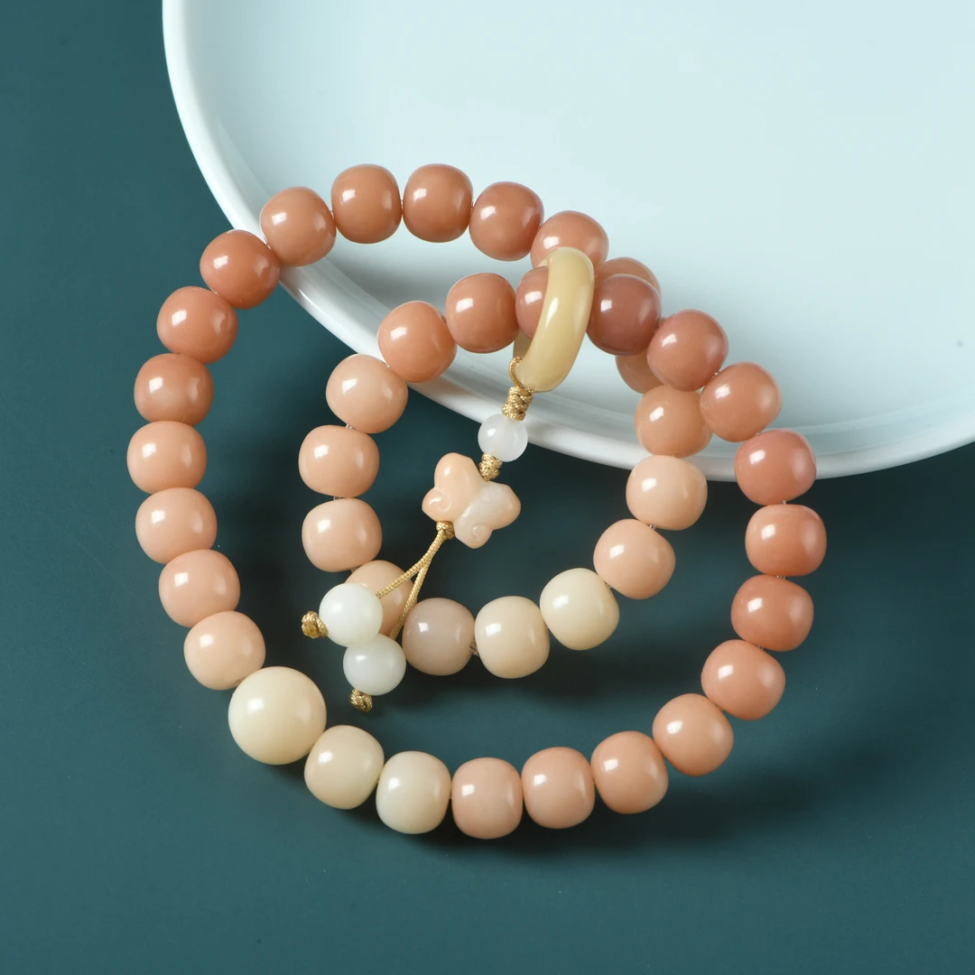 菩提根桃粉渐变色9x10老型珠双圈手链手持