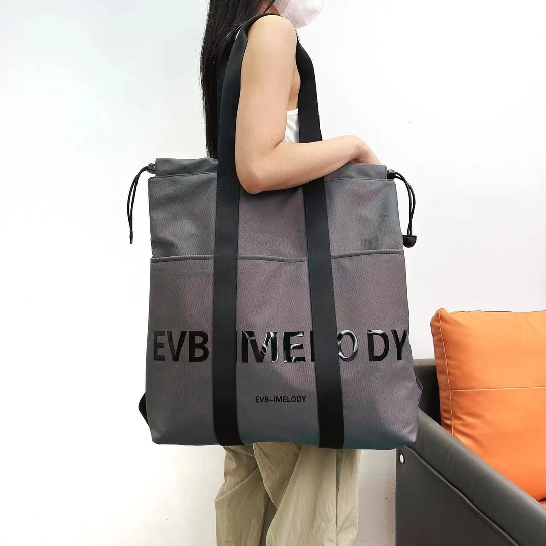 EVB潮流大容量手提包休闲百搭通勤水桶单肩多功能抽绳韩版双肩包