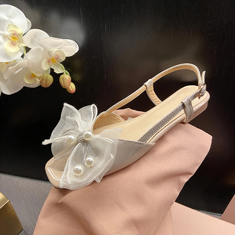 仙女风2023年夏季蝴蝶结露趾平底韩系后空鱼嘴珍珠一字带凉鞋女