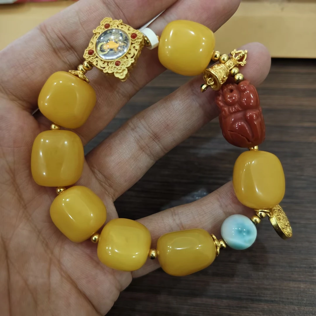 九乐异形蜜蜡珠海纹石南红手串