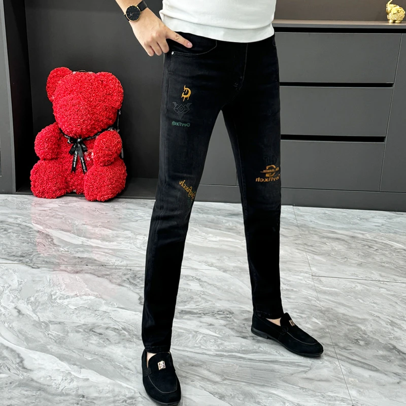 春秋新款黑色牛仔裤男士时尚个性刺绣修身小脚裤休闲帅气直通长裤