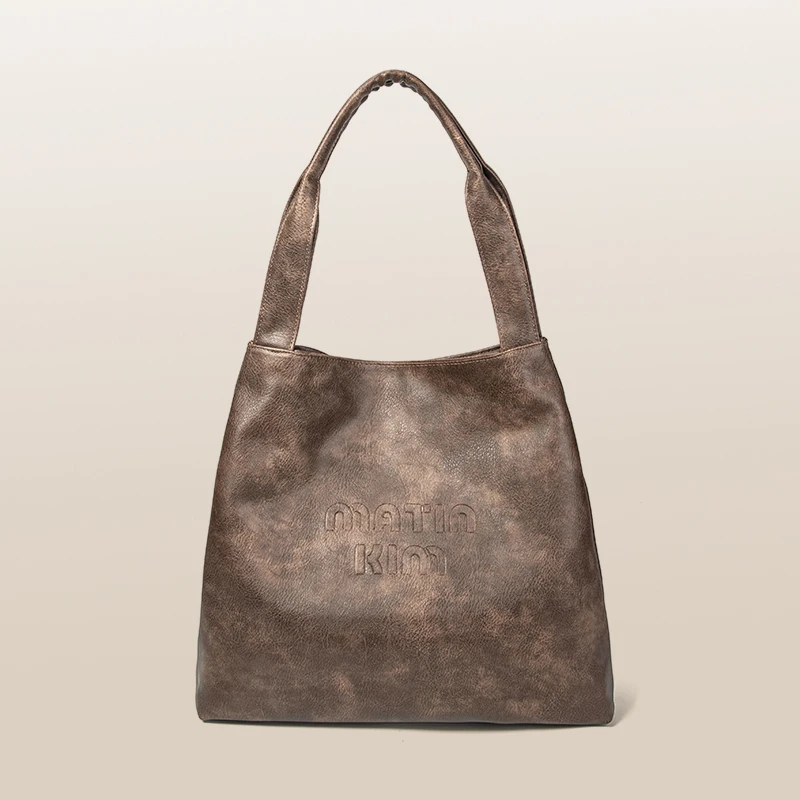 MATIN KIM新款废土风纽扣女士休闲大容量竖款托特包单肩小众