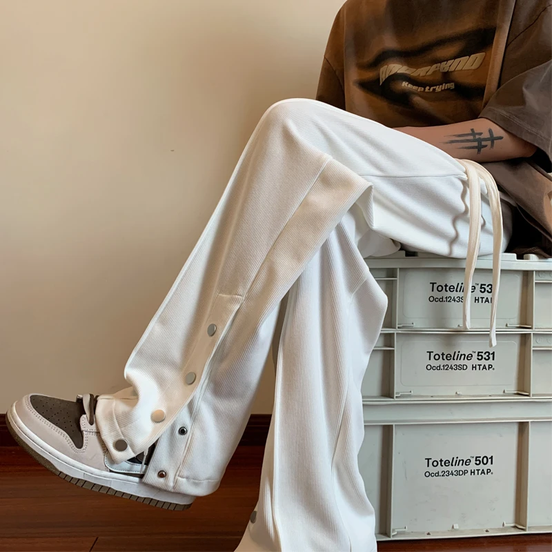 2023秋冬新款潮牌卫裤男青少年时尚潮流休闲百搭显瘦宽松纽扣设计