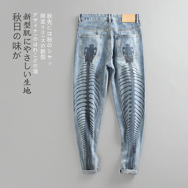 牛仔裤男鱼骨背面印花直筒宽松小脚哈伦破洞美式潮流水洗个性裤子