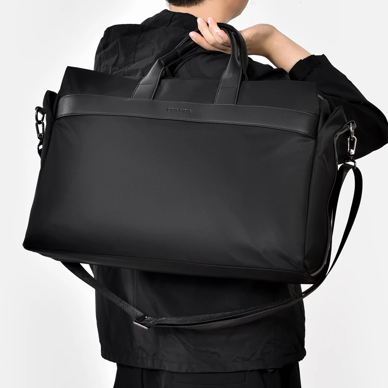 新款短途旅行包牛津布男士手提行李袋大容量防水黑色商务出差包袋