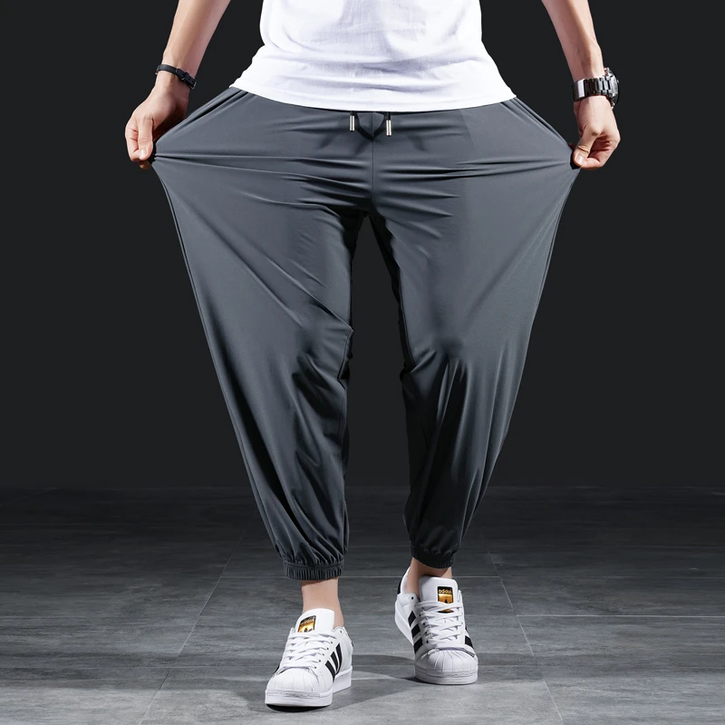 运动裤男夏季卫裤冰丝九分裤弹力速干休闲垂感束脚加肥加大码裤子