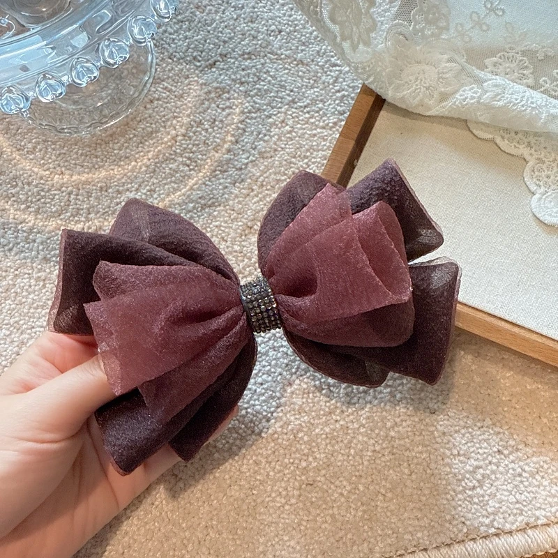 jioli/椒莉韩国高级感蝴蝶结水钻弹簧夹气质雪纺纱后脑勺顶夹发夹