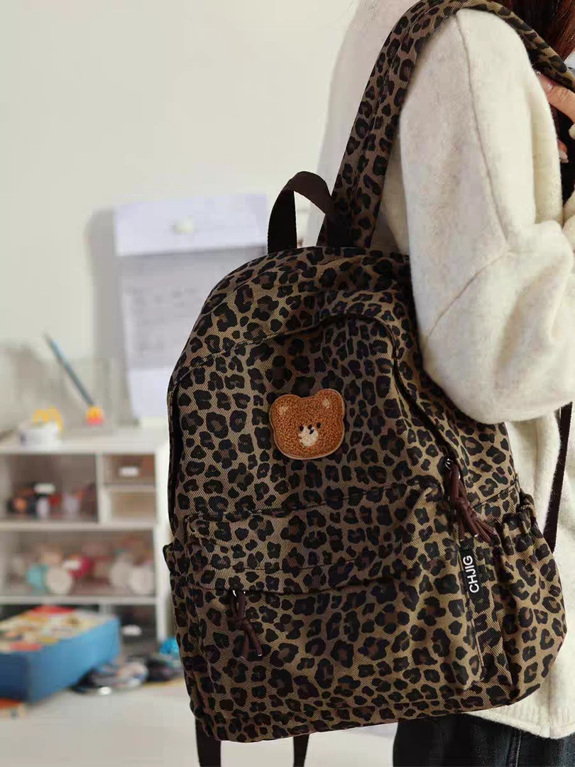 书包初中女生大学生ins小众豹纹双肩包女2025新款旅游轻便背包潮