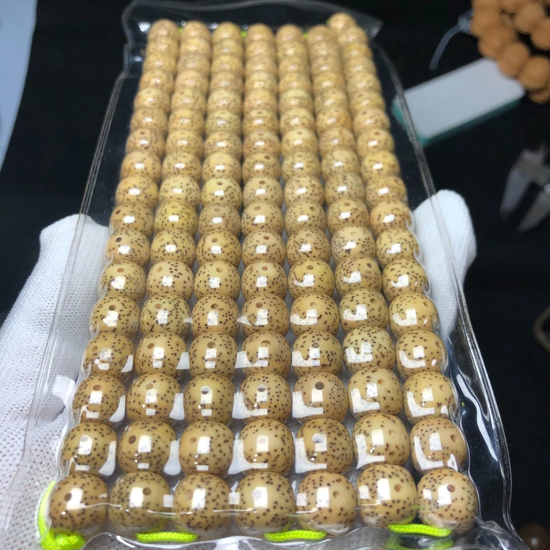 星月菩提11×10桶原生态鸡油黄大眼睛脖挂月带留白120颗左右