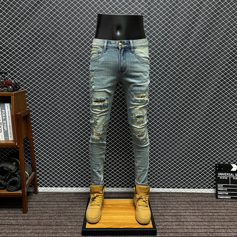 欧版破洞牛仔裤男款秋冬新款潮流水洗浅蓝色弹力修身小脚长裤子男