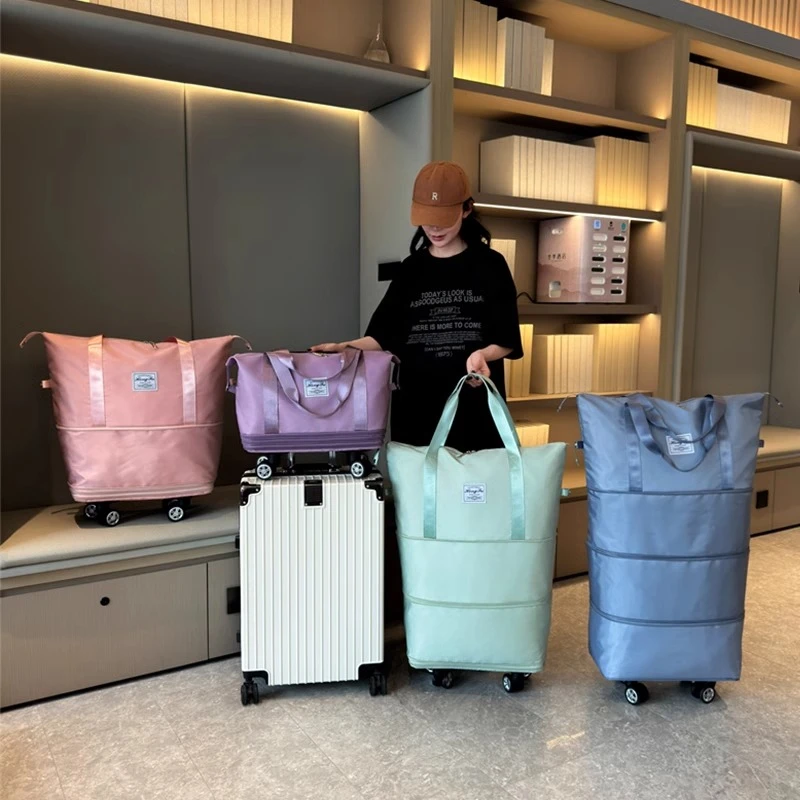 搬家袋2025年新款便携手拉行李袋带滑轮收纳包大容量健身包旅行包