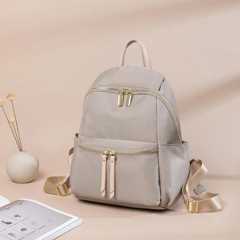 米琦袋鼠牛津布双肩包女2025新款书包简约时尚大容量帆布旅行背包