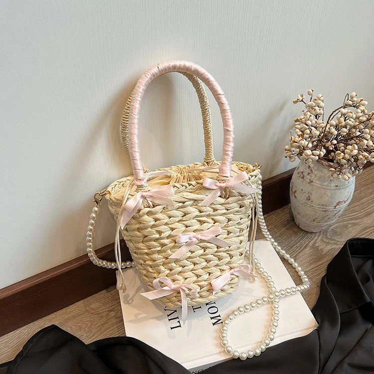 夏天手提编织包包女式2024新款时尚草编水桶包百搭休闲珍珠斜挎包