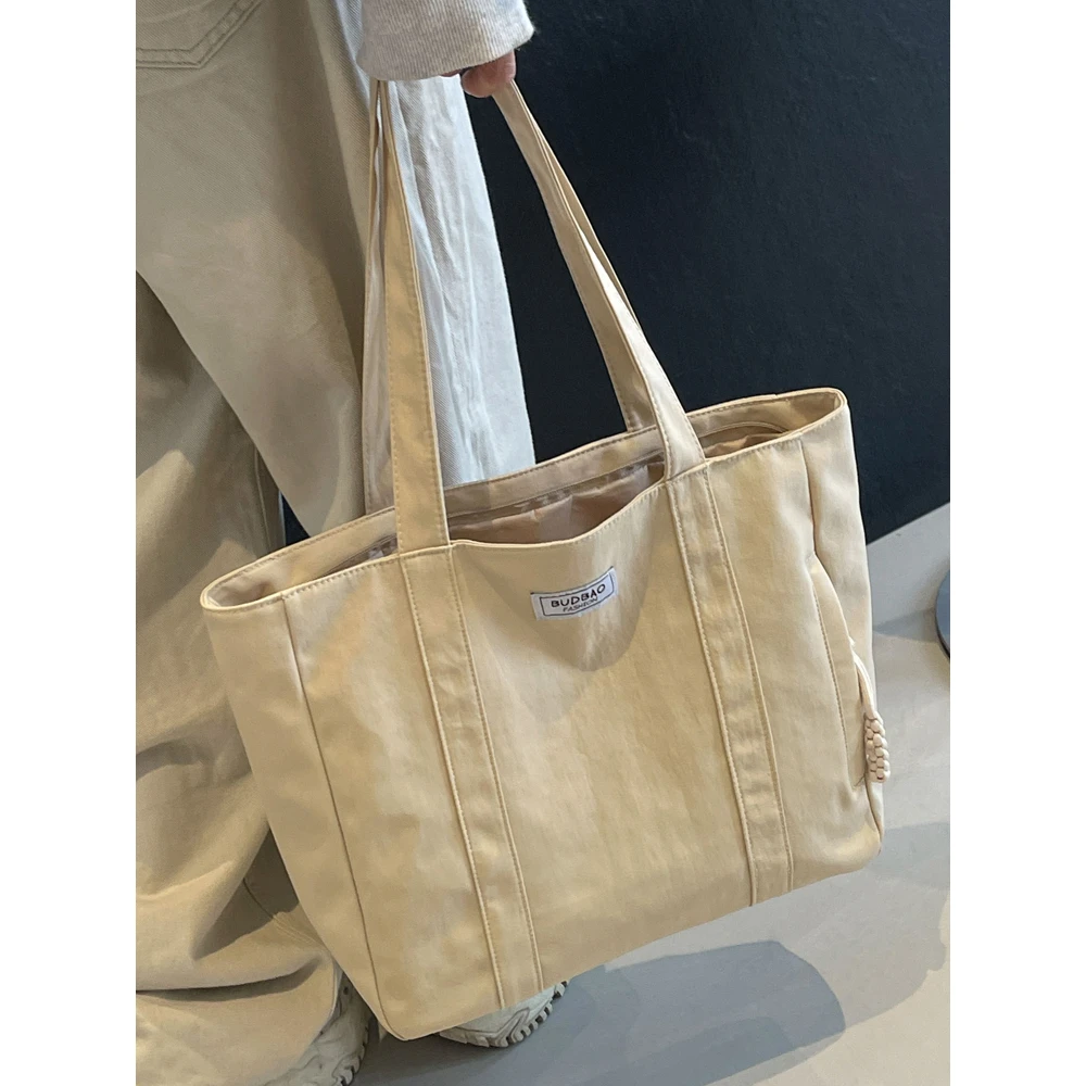 时尚休闲帆布大包包女士2024新款学生上课通勤包大容量百搭单肩包