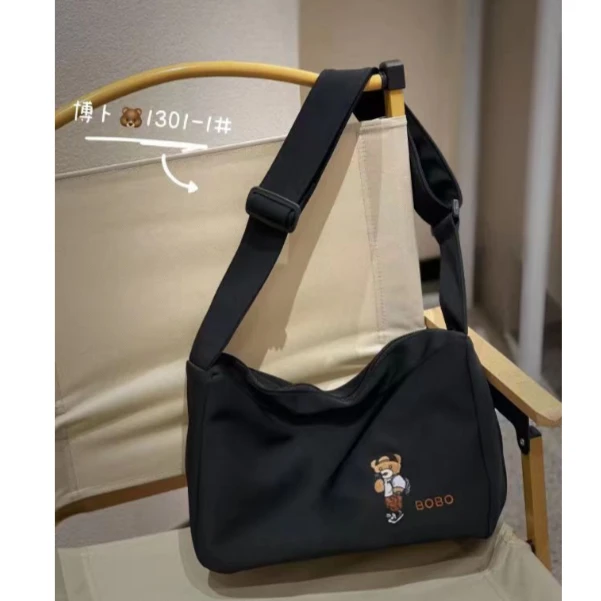 时尚休闲小众百搭日系单肩运动潮流学生情侣布包简约腋下邮差包