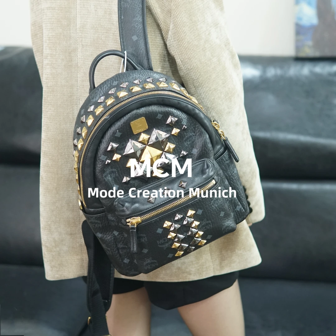 95新 MCM 黑金双肩包/SD10717080/7080