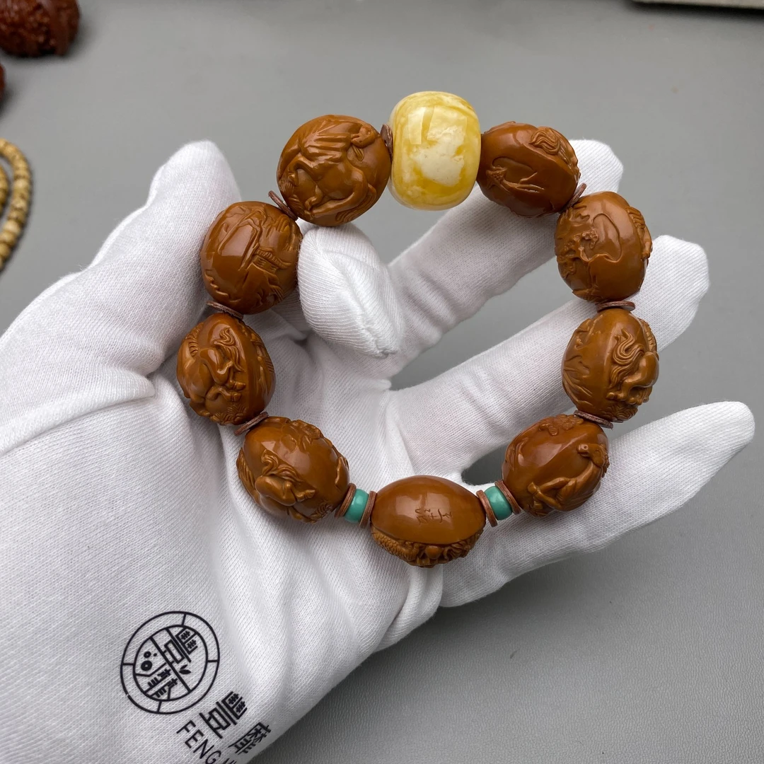 丰靡社橄榄核雕刻马